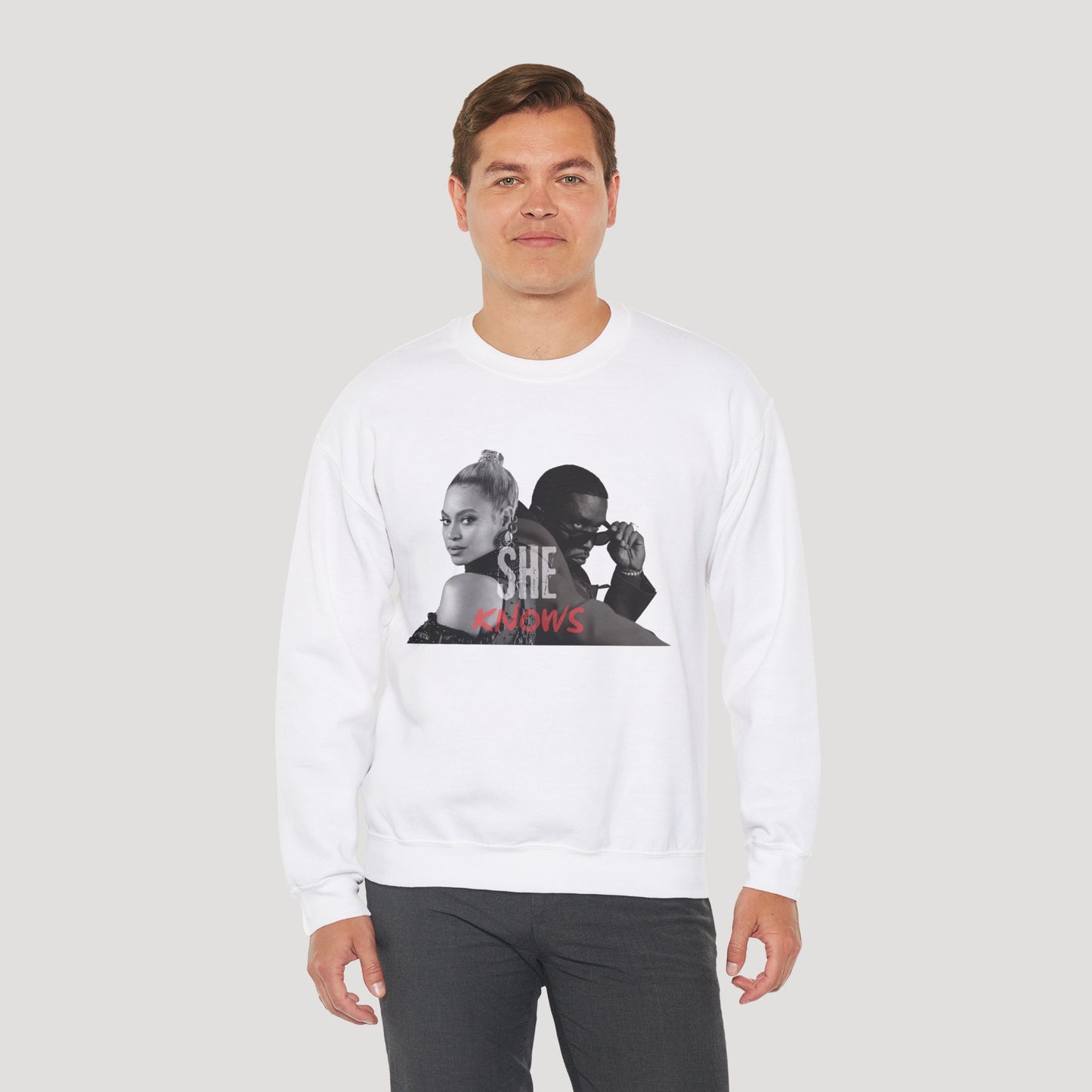 'She Knows' - Unisex Heavy Blend Crewneck Sweatshirt