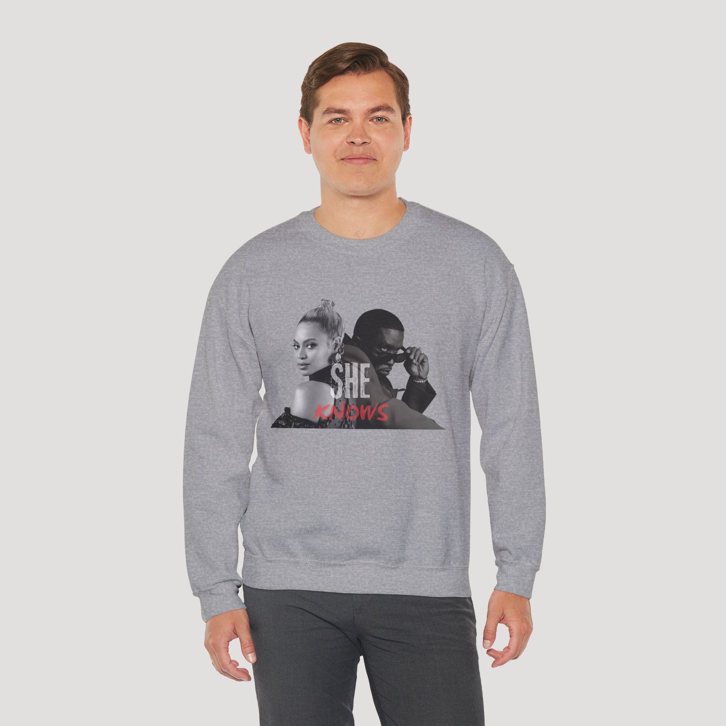 'She Knows' - Unisex Heavy Blend Crewneck Sweatshirt