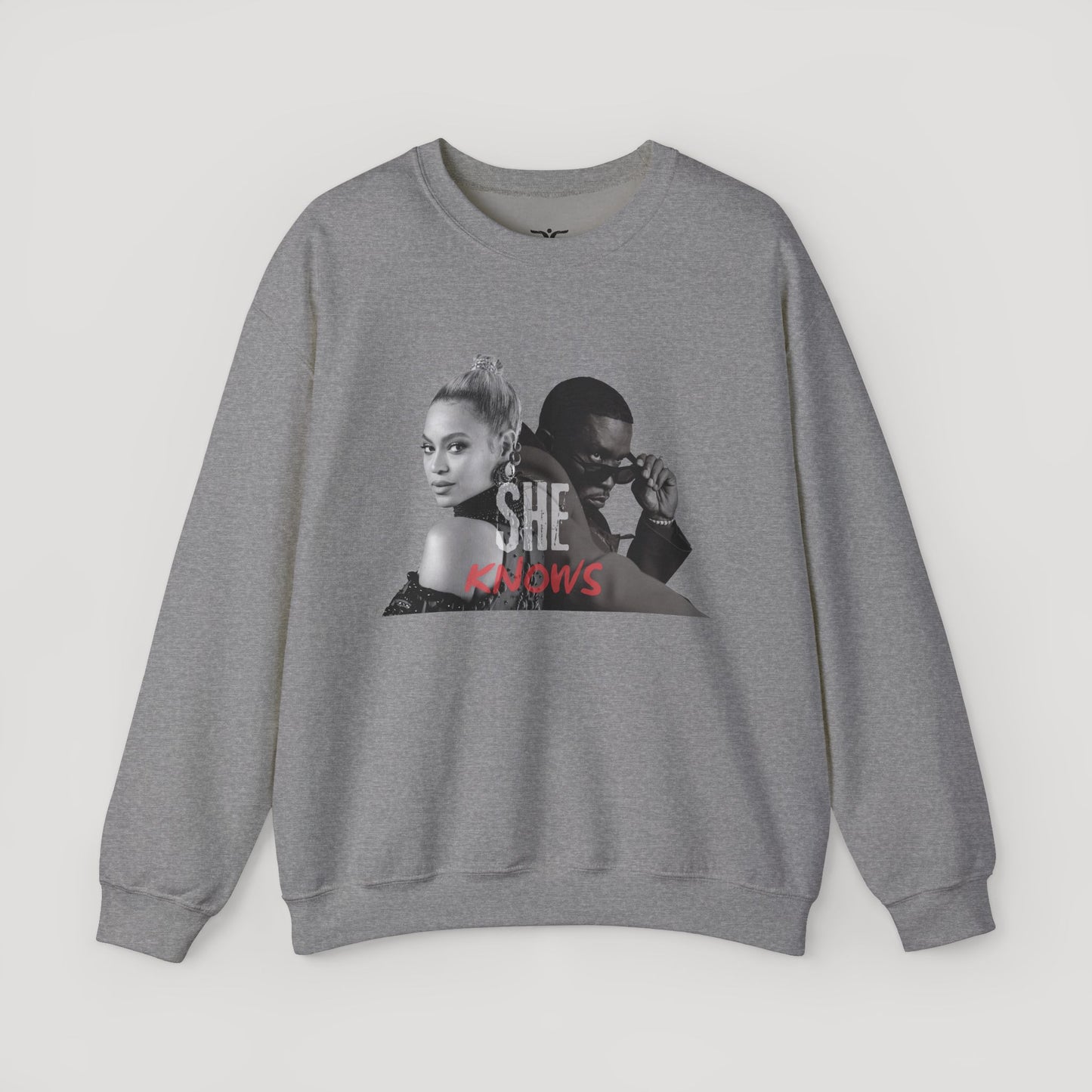 'She Knows' - Unisex Heavy Blend Crewneck Sweatshirt