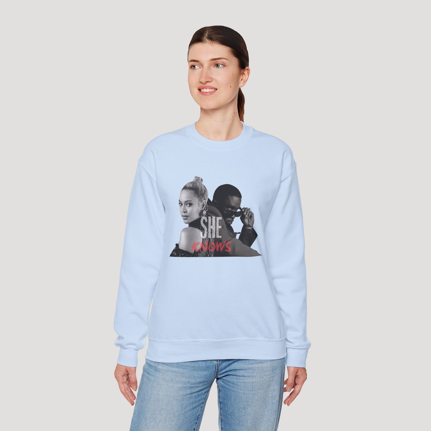 'She Knows' - Unisex Heavy Blend Crewneck Sweatshirt