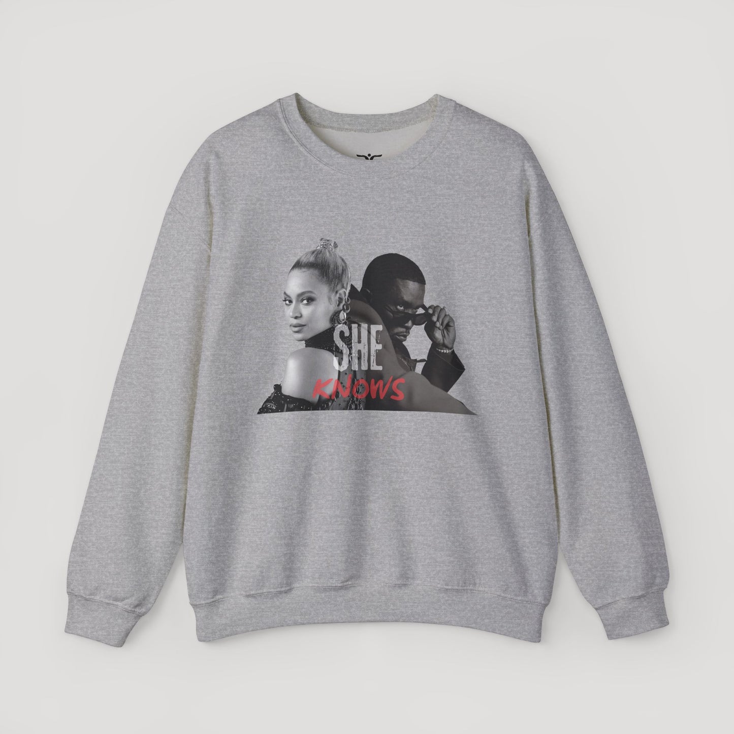 'She Knows' - Unisex Heavy Blend Crewneck Sweatshirt