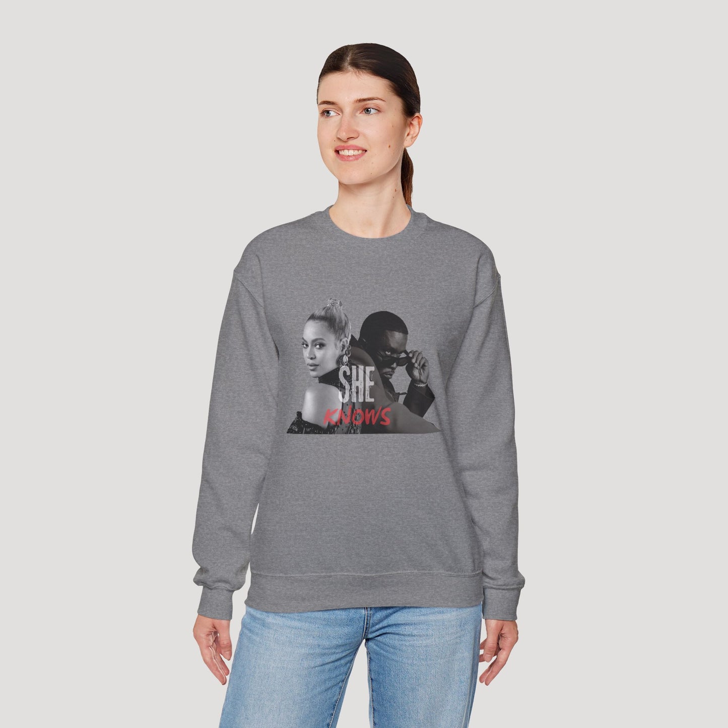 'She Knows' - Unisex Heavy Blend Crewneck Sweatshirt