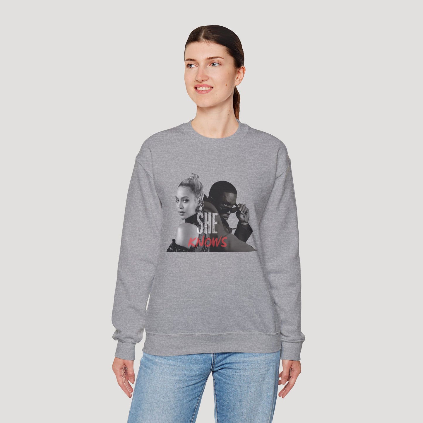 'She Knows' - Unisex Heavy Blend Crewneck Sweatshirt