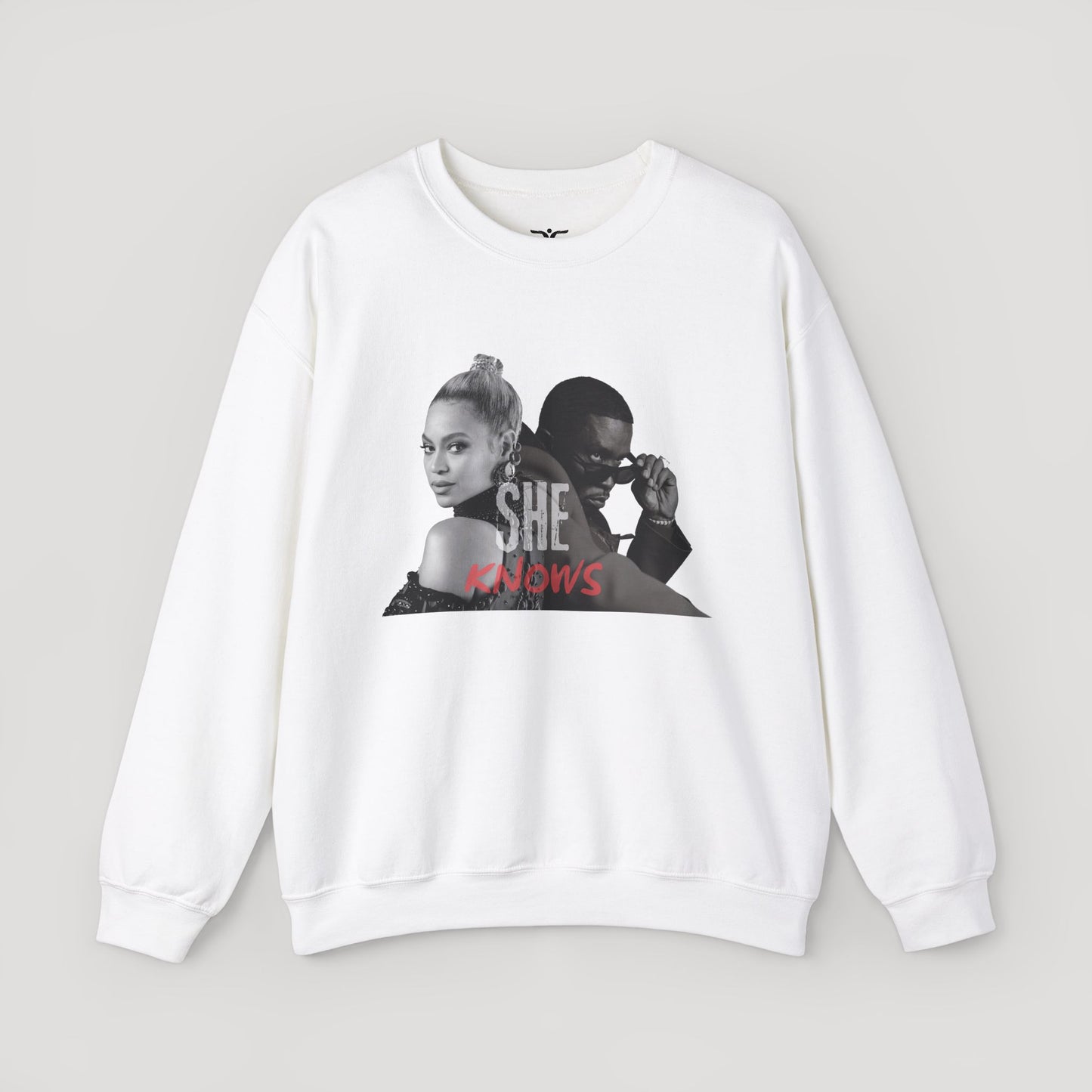 'She Knows' - Unisex Heavy Blend Crewneck Sweatshirt